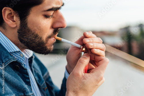 Close-up of a man smoking a cigarette