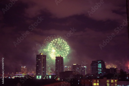fireworks on Bangkok city skyline new years eve celebration