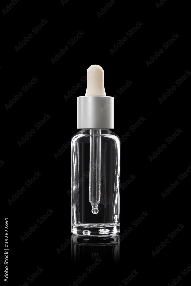 glass dropper bottle. With a white cap on a black background glass dropper bottle. With a white cap on a black background