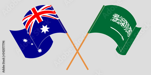 Crossed and waving flags of Australia and the Kingdom of Saudi Arabia