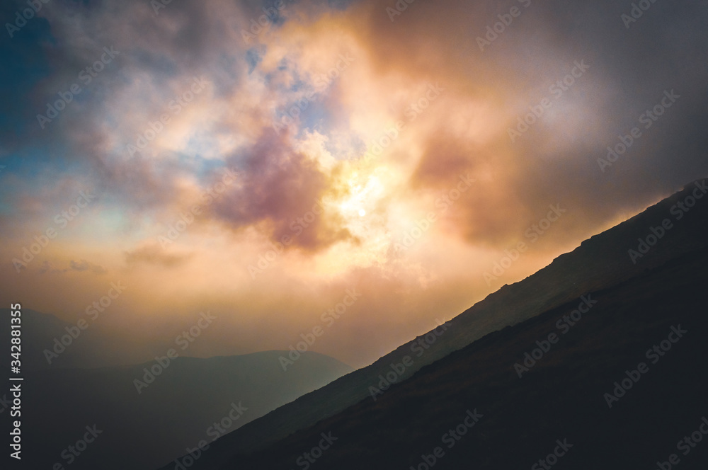 Cloud formation at sunset over the mountain ridge