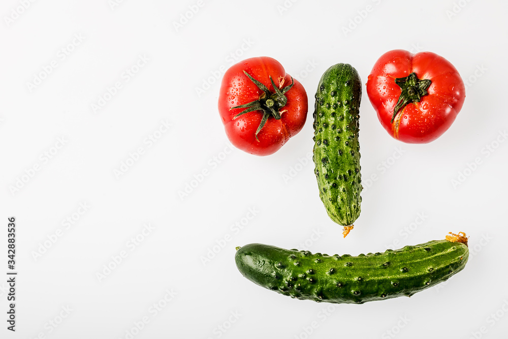 Fresh vegetables smile on a white background. The view from the top Fresh vegetables smile on a white background. The view from the top