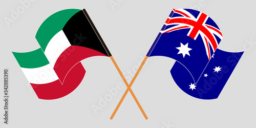 Crossed and waving flags of Australia and Kuwait