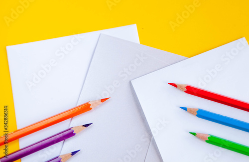 A set of stationery. School background with school equipment with place for your text. Vector illustration of realistic colored pencils and leaves.Flat lay. school supplies. office 