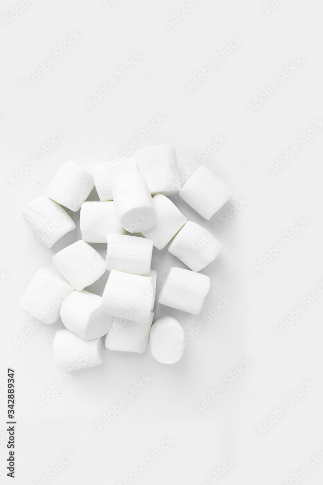 White marshmallows on a white background, top view

