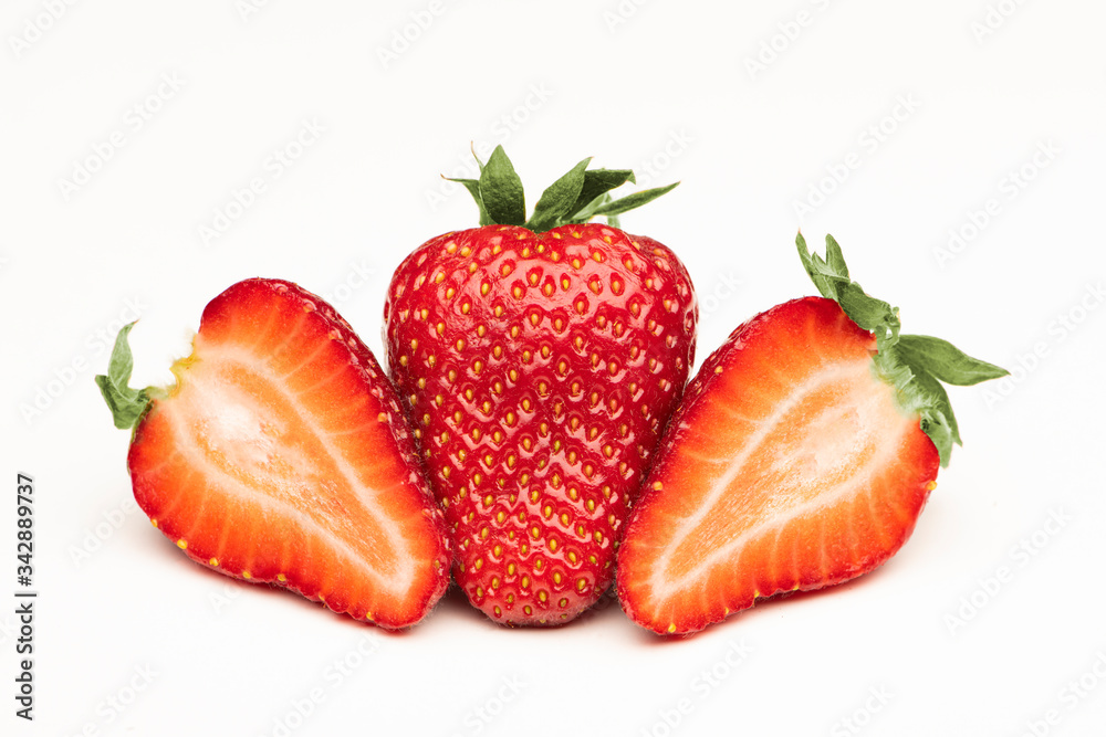 Fresh big strawberries on a white surface Fresh big strawberries on a white surface