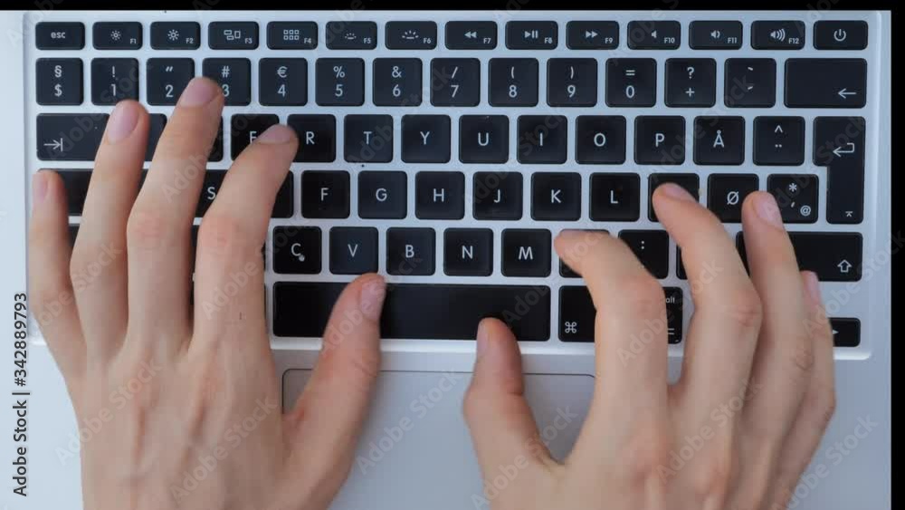 Close up of female typing hands on laptop keyboard Close up of female typing hands on laptop keyboard