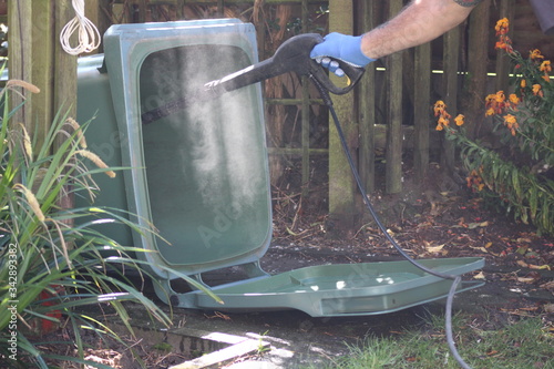 jet washing the wheely bin 