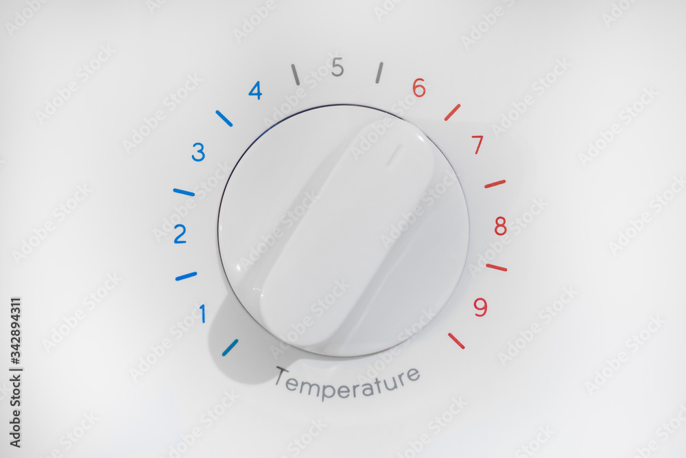 Thermostat with nine levels of temperature regulation, blue cold zone and red hot, white dial on 6 position, isolated on white background. Thermostat with nine levels of temperature regulation, blue cold zone and red hot, white dial on 6 position, isolated on white background.