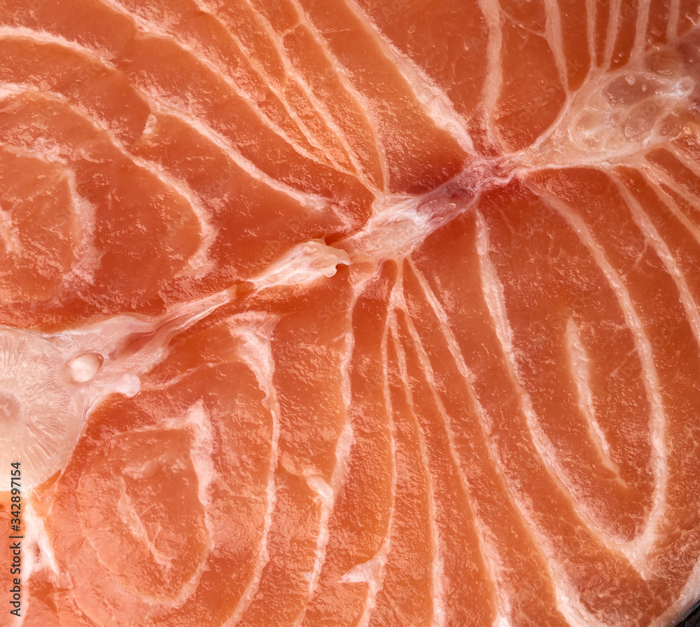 raw salmon steak texture on black background