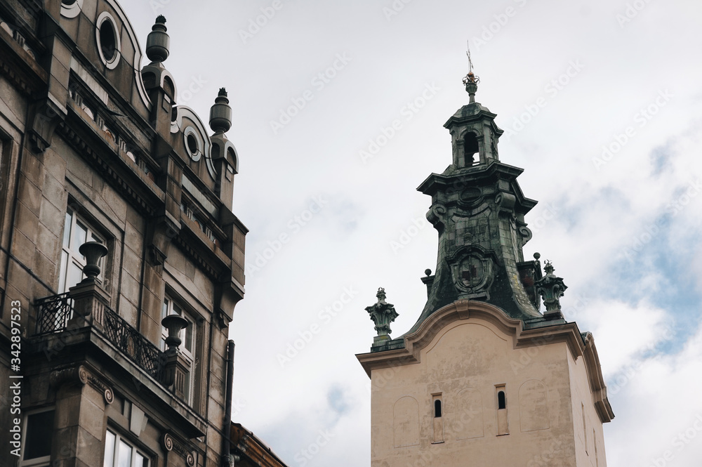 An old tower of the Latin Cathedral of the Assumption of the Virgin Mary in Lviv. Historical part of the city, view from below against the sky.