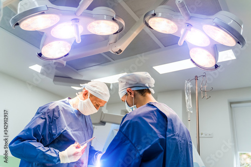 Modern equipment in operating room. Team surgeon at work in operating room.