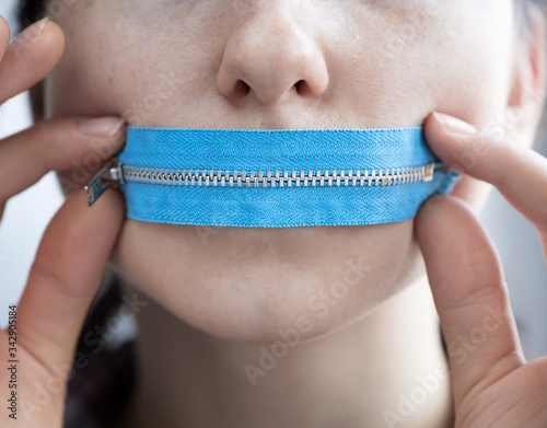 Zipper mouth on the girl's face
