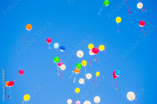 colorful balloons flying in the blue sky