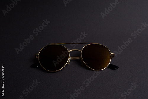 sunglasses on black background