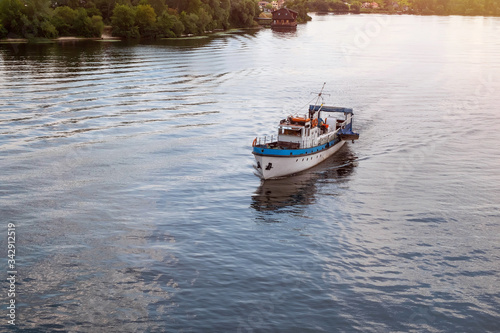 Old boat on the river at sunset. Motor boat, close up.