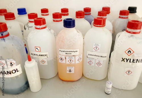 Liquid chemicals and waste bottles in a chemistry lab  photo