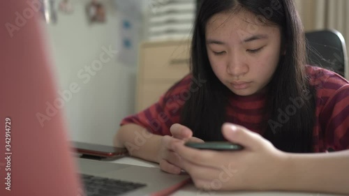 Women use phones to liaise and research online at home