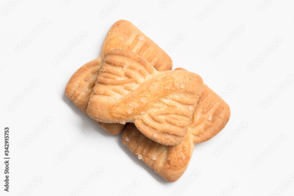 Freshly baked sugar cookies on white background in top view close up Freshly baked sugar cookies on white background in top view close up