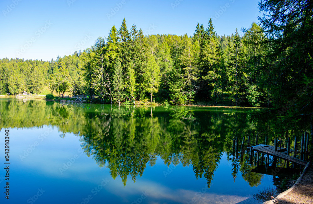 Fototapeta premium Italy, Trentino-Alto Adige/Südtirol - 15 september 2019 - An extraordinary reflection in the alpine lake of Santa Maria