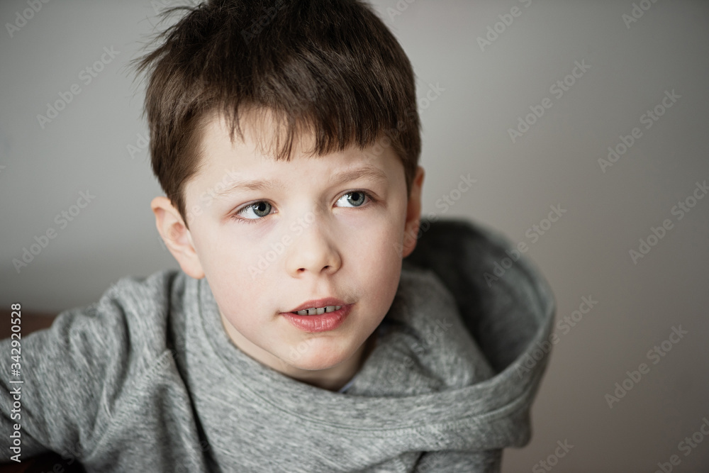 large portrait of a boy who grimaces, opens his mouth large portrait of a boy who grimaces, opens his mouth