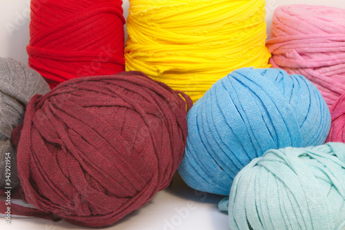 Beautiful composition of colored balls of fabric for knitting, needle and crafts