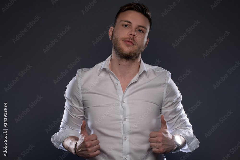 Fototapeta premium Portrait of beautiful man on grey background. Studio Isolated