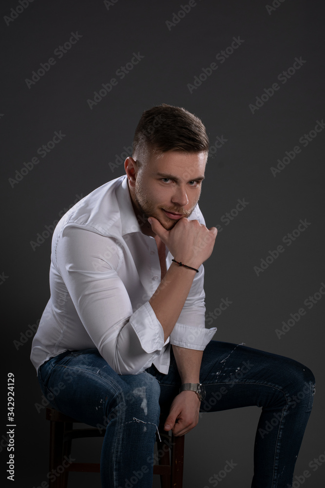 Portrait of beautiful man on grey background. Studio Isolated Portrait of beautiful man on grey background. Studio Isolated