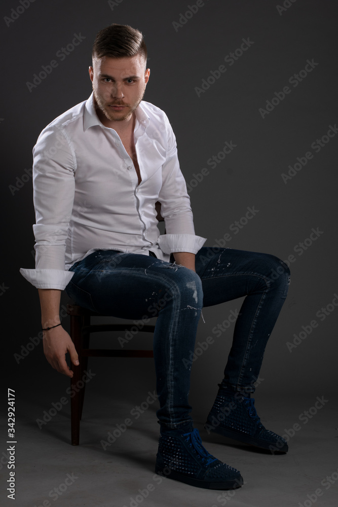 Portrait of beautiful man on grey background. Studio Isolated