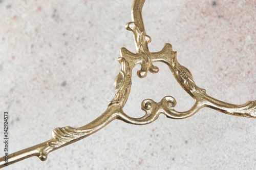 Antique brass clothes hanger