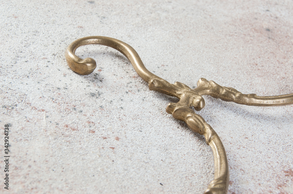 Obraz premium Antique brass clothes hanger