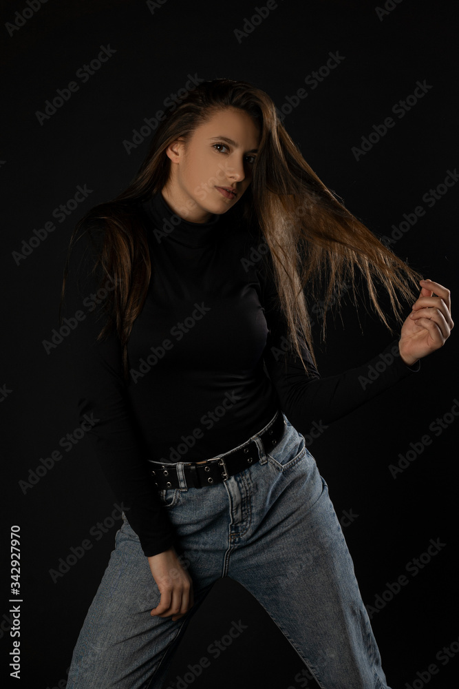 Girl posing sexy expression in studio on black background. Isolated Girl posing sexy expression in studio on black background. Isolated