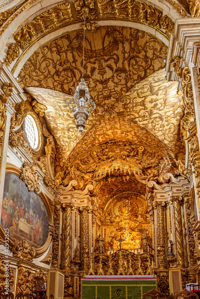 Interior and altar of historic church all painted in gold with baroque architecture in the old city of Tiradentes in Minas Gerais state, Brazil