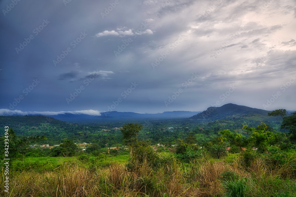 Clouds gather above the hills and rain forest of sub-saharan West Africa in the bush of Ghana. Clouds gather above the hills and rain forest of sub-saharan West Africa in the bush of Ghana.