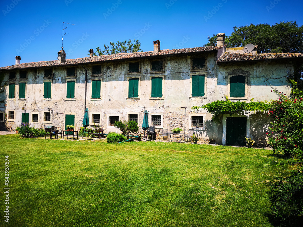 Typical farm house in the green countryside of the hills of Veneto, Italy.