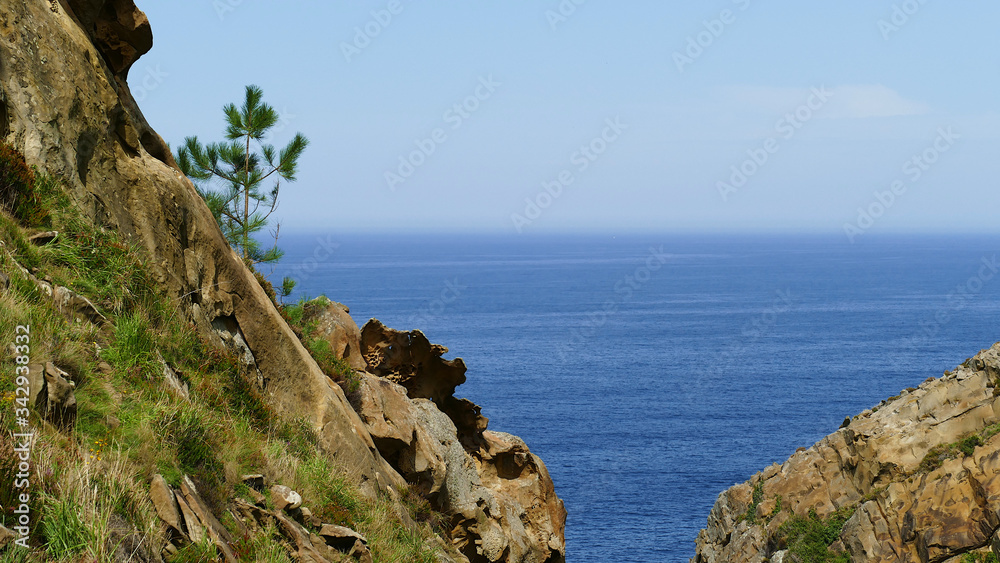 Cantabrian Sea coast in the Basque Country. Cliff of Mount Jaizkibel with eroded rocks.