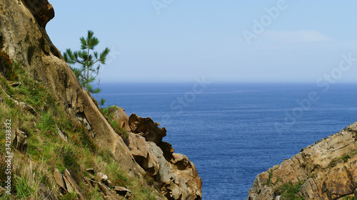 Cantabrian Sea coast in the Basque Country. Cliff of Mount Jaizkibel with eroded rocks.