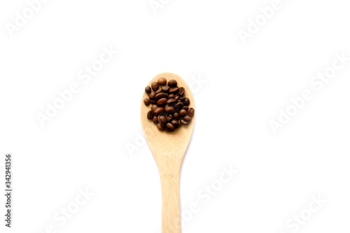 coffee beans on a wooden spatula. White background.