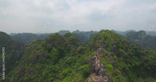 Aerial view of Tam Coc Bich Dong, part of the Trang An Scenic Landscape Complex UNESCO World Heritage site, Ninh Binh. Tam Coc is a flooded cave karst system, Bich Dong is a series of moutain pagodas photo