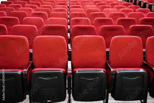 red velor chairs in the auditorium, without people 