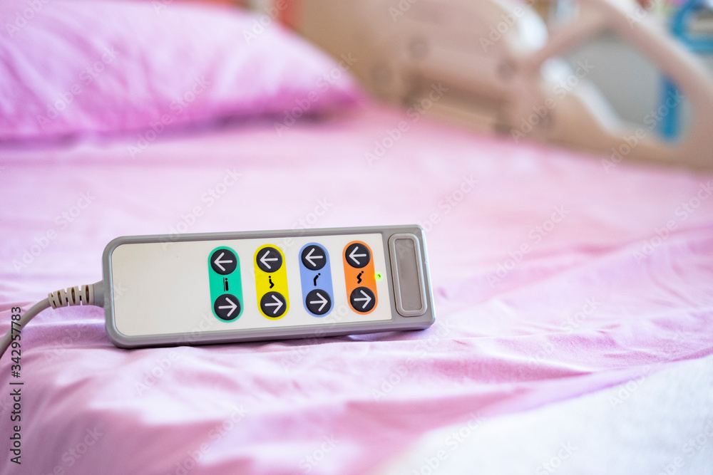 hospital bed remote control controlling adjusting head position of bed for  patients comfortability, medical care and healthcare concept accessories  and equipment in hospital bed in background Stock Photo | Adobe Stock