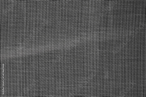 dark abstract background: unique wavy pattern of overlaying two grids, blurred and tinted in gray