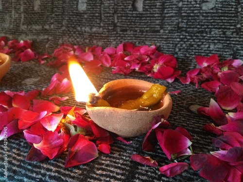 still life with rose petals and candle