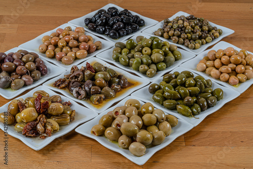 Olives assortment in bowl with oil. 