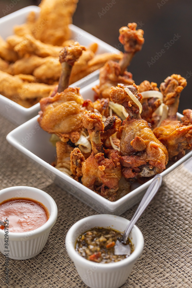 fried chicken drumsticks and breaded chicken breast strips with dressings fried chicken drumsticks and breaded chicken breast strips with dressings