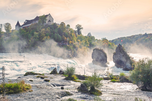 Mighty white rapids of the Rhine River at the Rhine Falls, the famous and biggest waterfall in Europe located in Schaffhausen, Switzerland photo