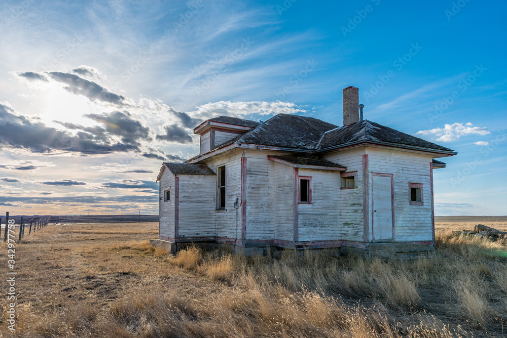 Sunset over the abandoned Frenchville one-room schoolhouse in Frenchville, SK