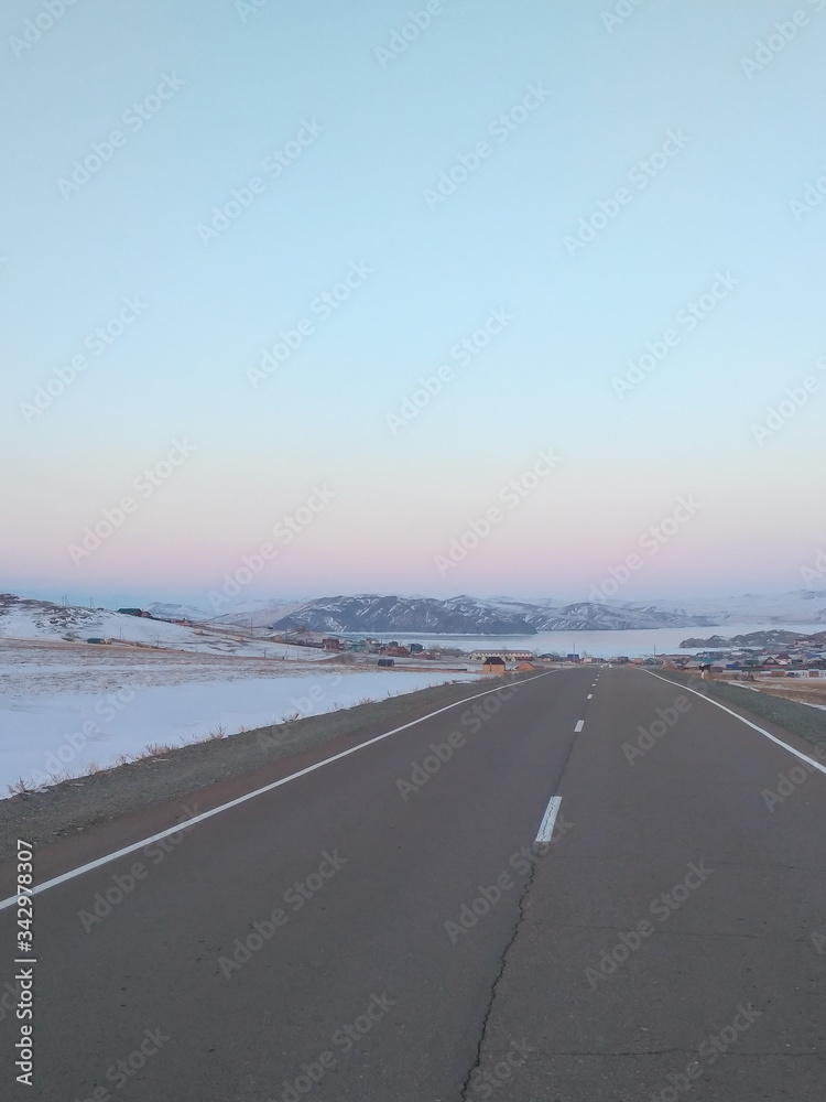 Road to Olkhon Island in winter at dawn