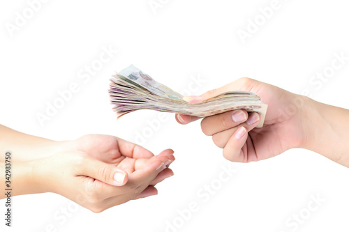 Closeup hands giving money isolated on white background