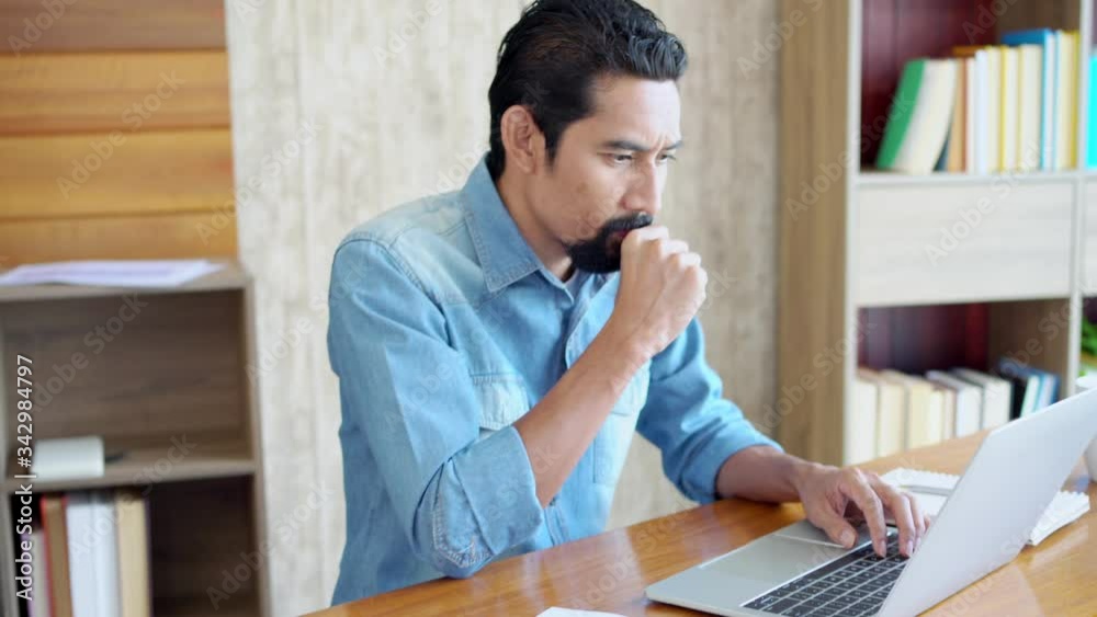 Asian businessman thoughtful, entrepreneur think about problem business investment concentrate information in computer laptop, small business owner worried about loss, bankrupt, worker work from home Asian businessman thoughtful, entrepreneur think about problem business investment concentrate information in computer laptop, small business owner worried about loss, bankrupt, worker work from home